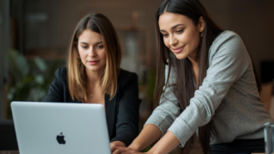 QB team working on laptop to resolve h202 error